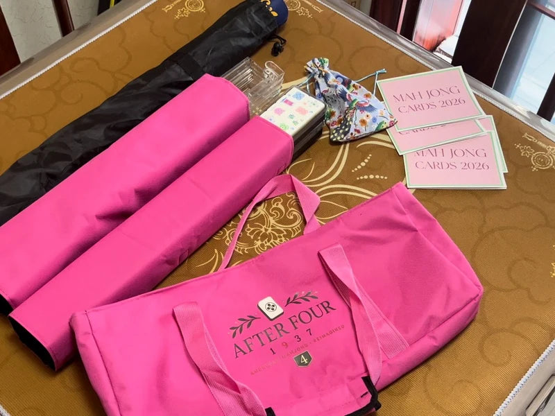 Pink carrying bag and protective sleeves with clear racks, a patterned pouch and reference cards viewed from above