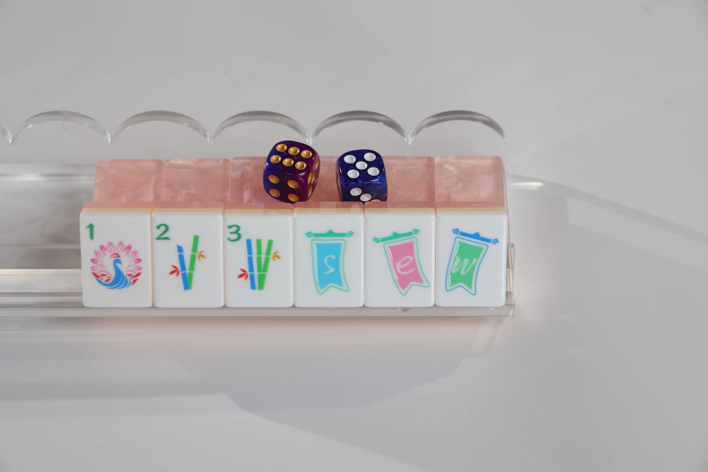 Blush Lotus American Mah Jongg tiles arranged on a clear rack
