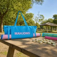 Blue canvas American Mah Jongg carrying bag — outdoor table