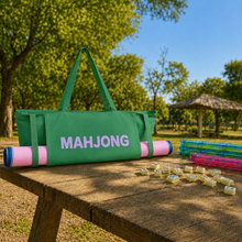 Green canvas American Mah Jongg carrying bag — outdoor table
