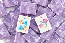 Amethyst Garden American Mah Jongg tiles with bird of paradise and flamingo artwork on lavender marbled backs