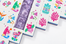 Detail of Amethyst Garden American Mah Jongg tiles with pink coral, tropical flowers and shoreline designs