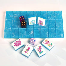Azure Tropics American Mah Jongg tile set with aqua marbled backs and tropical illustrated faces