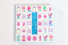Azure Tropics American Mah Jongg tile designs arranged around an aqua marbled tile back