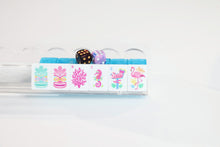 Azure Tropics American Mah Jongg coral and flower tiles displayed on a clear rack with styling dice