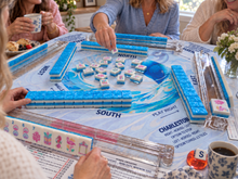 Azure Tropics American Mah Jongg tile set in play on a blue table mat with friends
