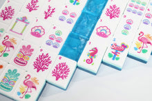 Detail of Azure Tropics American Mah Jongg tiles showing pink coral, seahorses and tropical symbols