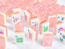 Standing Blush Lotus American Mah Jongg tiles showing colorful faces and pink marbled backs