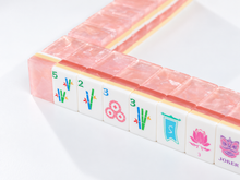 Angled view of a Blush Lotus American Mah Jongg tile wall showing layered pink edges