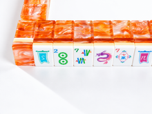 Front view of Coral Lotus American Mah Jongg tile wall with colorful illustrated faces