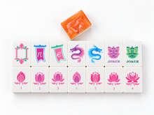 Coral Lotus American Mah Jongg lotus, dragon and Joker tiles arranged in two rows