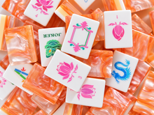Scattered Coral Lotus American Mah Jongg tiles with lotus flowers, Joker masks and orange backs