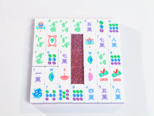 Pink Stardust American Mah Jongg tile designs arranged around a pink glitter back