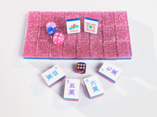 Wide product view of Pink Stardust American Mah Jongg tiles with pink glitter backs and styling dice