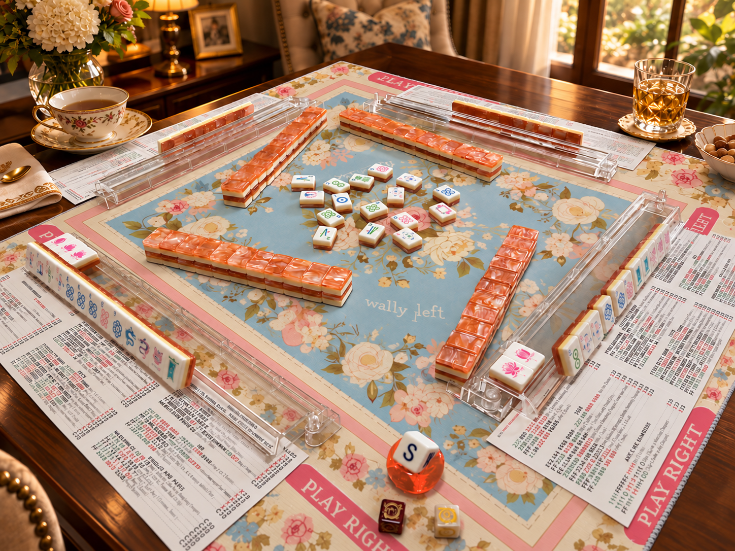 Coral orange American Mah Jongg set arranged with clear racks on a warmly lit game table